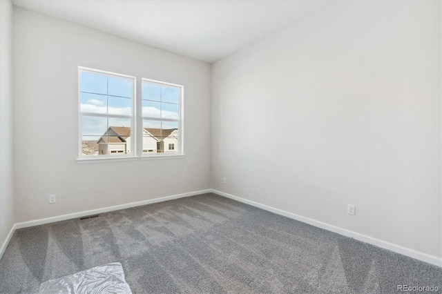 unfurnished room featuring carpet flooring