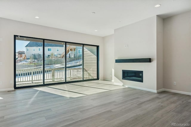 unfurnished living room featuring light hardwood / wood-style floors