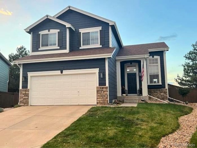 view of front facade featuring a garage, stone siding, concrete driveway, and a front yard