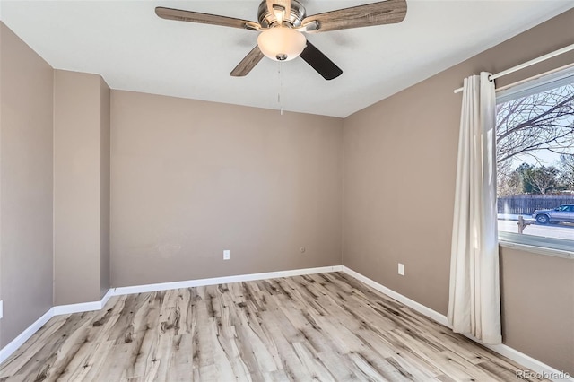 unfurnished room with ceiling fan and light hardwood / wood-style floors