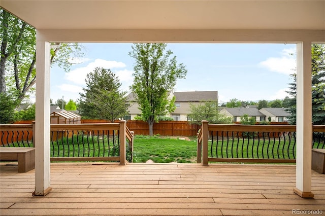 wooden terrace with a residential view
