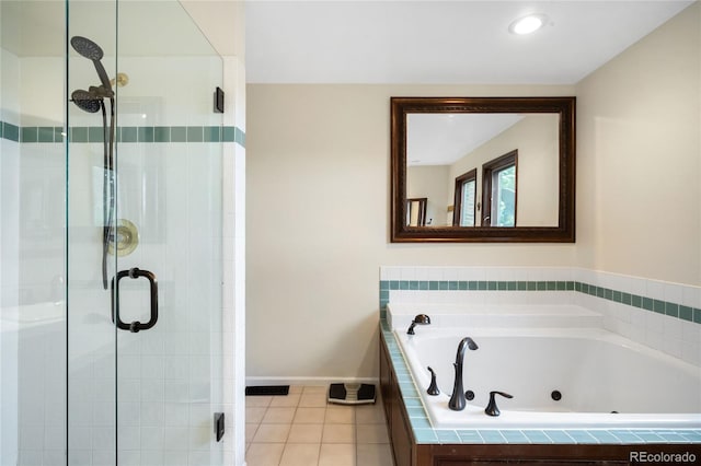 full bathroom featuring a shower stall, tile patterned floors, a jetted tub, baseboards, and recessed lighting