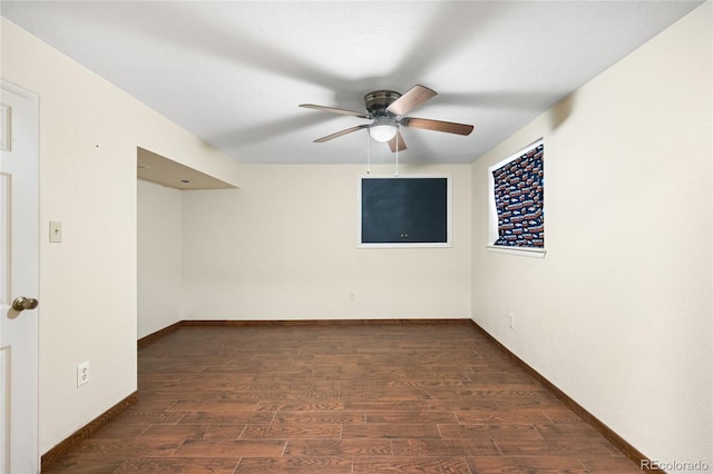 unfurnished room featuring ceiling fan, wood finished floors, and baseboards