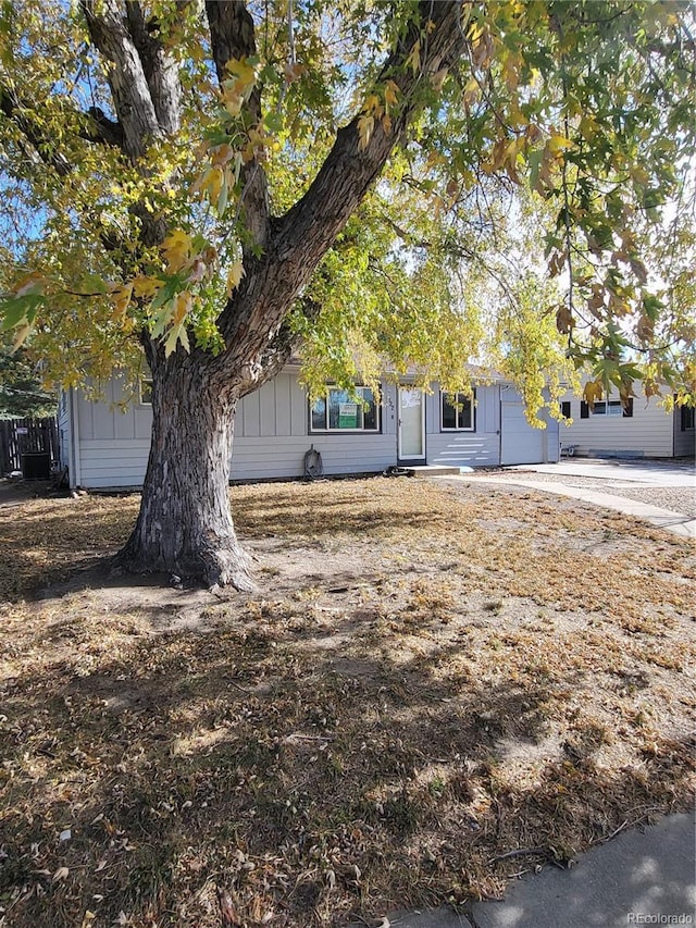 view of property hidden behind natural elements