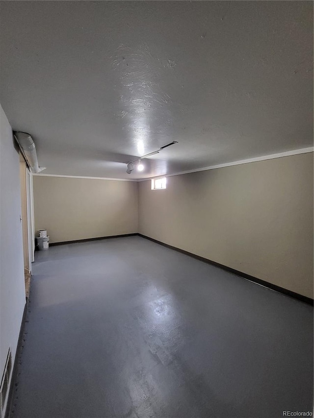 interior space featuring concrete flooring and a textured ceiling