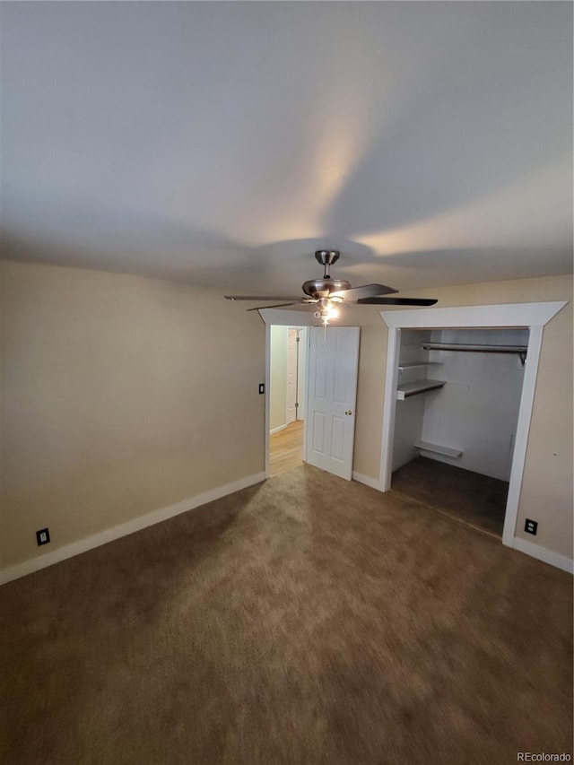 unfurnished bedroom featuring carpet, a closet, and ceiling fan