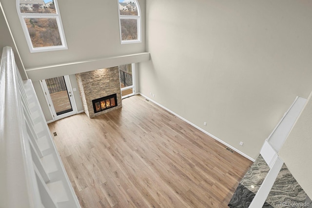 2866 Tenderfoot Hill St, Colorado Springs, CO 80906 - unfurnished living room with baseboards, wood finished floors, and a fireplace