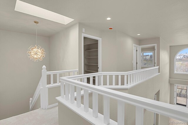 2866 Tenderfoot Hill St, Colorado Springs, CO 80906 - stairway featuring a skylight, carpet, an inviting chandelier, and recessed lighting