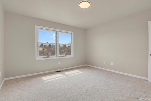 2866 Tenderfoot Hill St, Colorado Springs, CO 80906 - unfurnished room featuring baseboards, visible vents, and light colored carpet