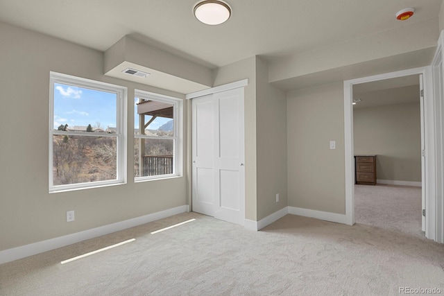 2866 Tenderfoot Hill St, Colorado Springs, CO 80906 - unfurnished bedroom with a closet, carpet floors, visible vents, and baseboards