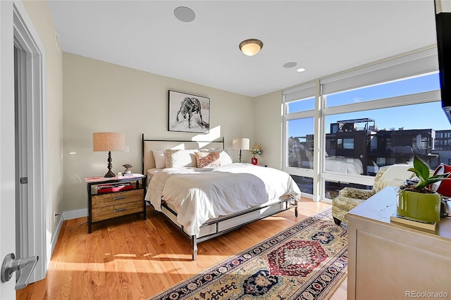 bedroom with light hardwood / wood-style floors