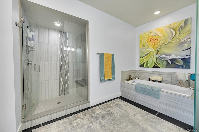 bathroom with separate shower and tub and tile patterned flooring