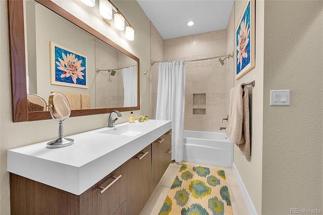 bathroom featuring vanity, shower / bathtub combination with curtain, and tile patterned flooring