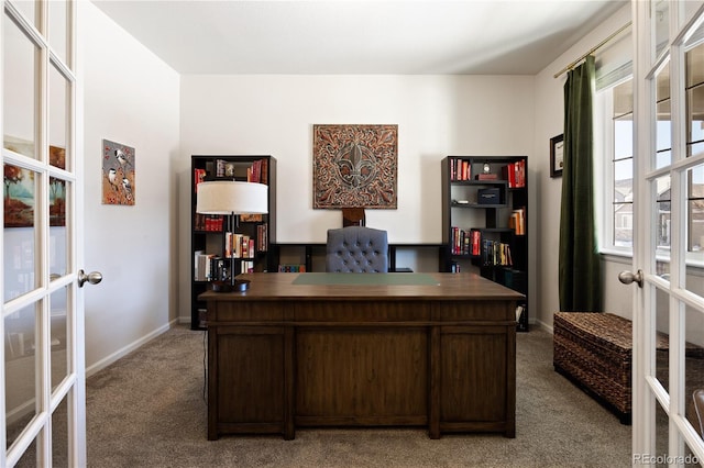 carpeted office featuring french doors