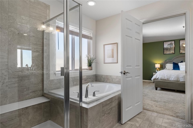 bathroom with shower with separate bathtub