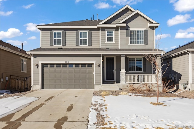 front facade featuring a garage and covered porch