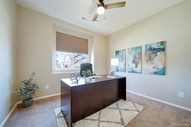 office with baseboards, carpet flooring, ceiling fan, and visible vents