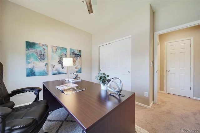 office area featuring light colored carpet and baseboards