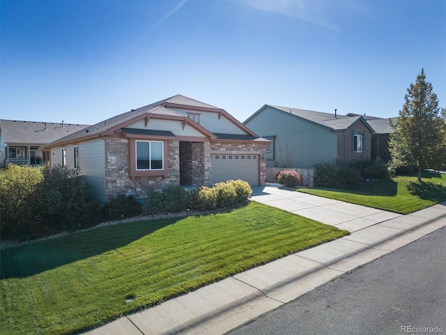 12340 Syracuse St, Thornton, CO 80602 - view of front of home with a front lawn, a garage, driveway, and stone siding