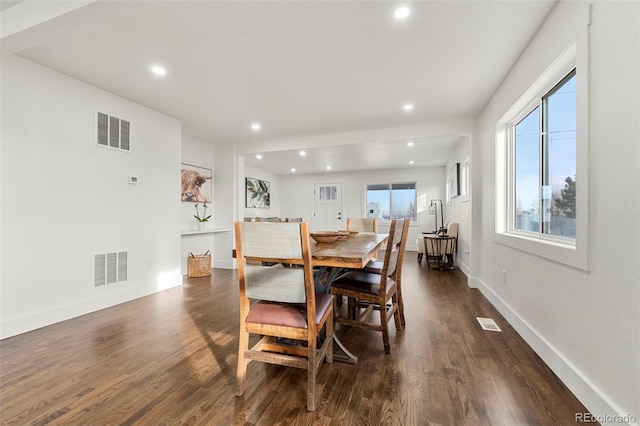 dining space featuring dark hardwood / wood-style flooring