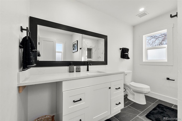 bathroom featuring vanity and toilet