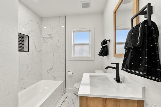 full bathroom featuring vanity, toilet, and tiled shower / bath combo