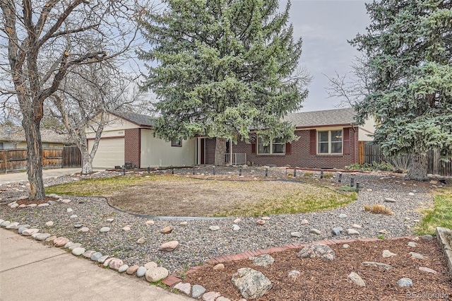 2056 S Newark Way, Aurora, CO 80014 - single story home featuring brick siding, an attached garage, and driveway