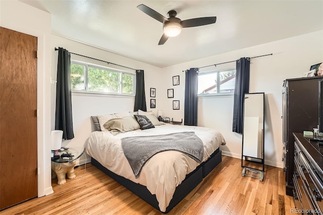 7060 Avrum Dr, Denver, CO 80221 - bedroom featuring light wood-style flooring, ceiling fan, and baseboards