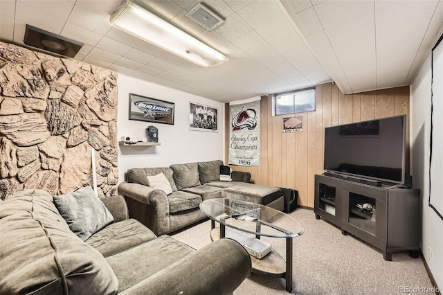7060 Avrum Dr, Denver, CO 80221 - living area featuring wooden walls and light colored carpet