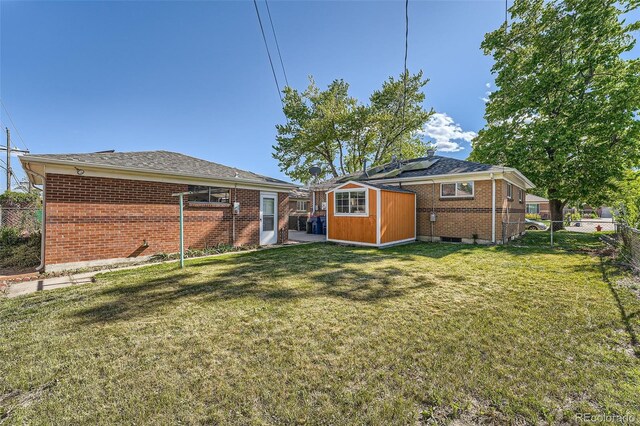 7060 Avrum Dr, Denver, CO 80221 - back of property with brick siding and solar panels