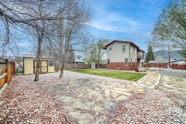 822 Yale Ave, Buena Vista, CO 81211 - back of property featuring a shed, an outbuilding, and a patio