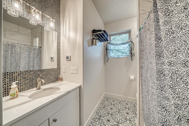 822 Yale Ave, Buena Vista, CO 81211 - full bathroom with tile patterned flooring, vanity, baseboards, curtained shower, and tasteful backsplash