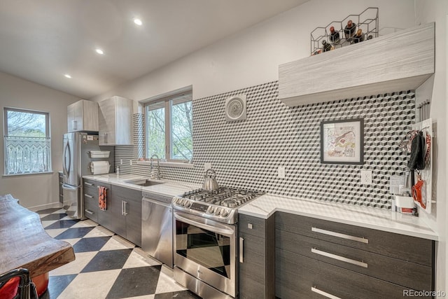 822 Yale Ave, Buena Vista, CO 81211 - kitchen featuring stainless steel appliances, a sink, light floors, decorative backsplash, and recessed lighting