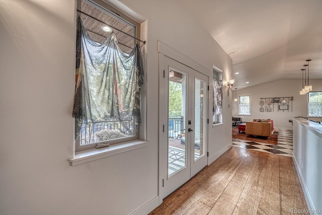 822 Yale Ave, Buena Vista, CO 81211 - doorway featuring hardwood / wood-style floors, lofted ceiling, and baseboards