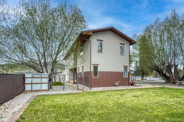 822 Yale Ave, Buena Vista, CO 81211 - rear view of house with a gate and stucco siding