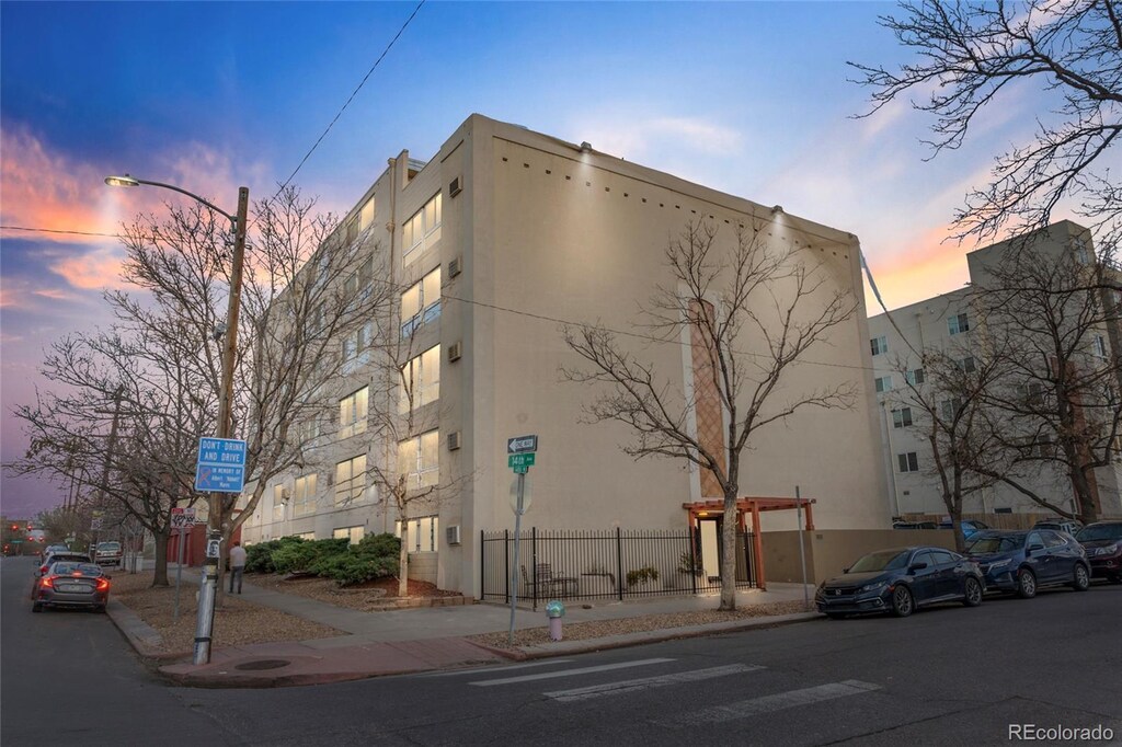 1390 N Emerson St Unit 106, Denver, CO 80218 - view of building exterior featuring fence