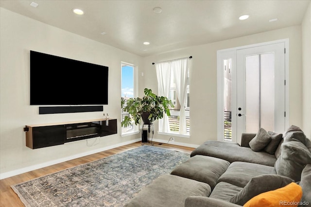 11205 W 53rd Ln, Arvada, CO 80002 - living area with wood finished floors, recessed lighting, and baseboards