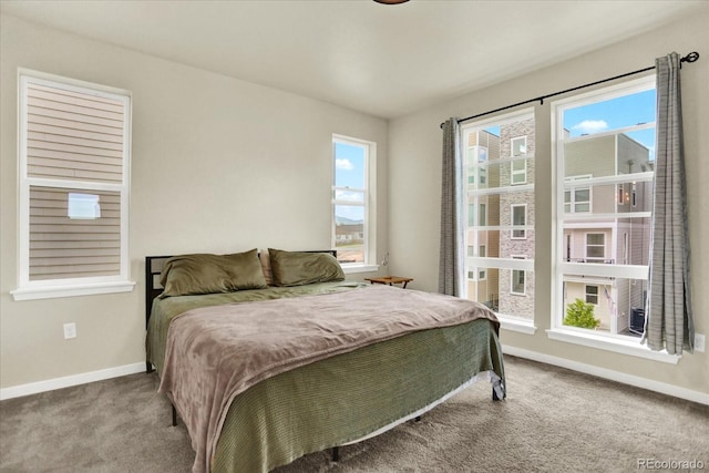11205 W 53rd Ln, Arvada, CO 80002 - carpeted bedroom with baseboards and multiple windows