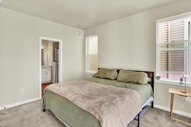 11205 W 53rd Ln, Arvada, CO 80002 - bedroom featuring carpet flooring, baseboards, and ensuite bathroom