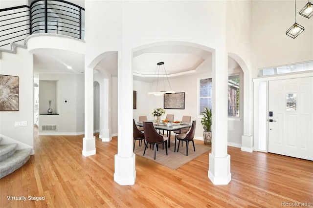 5352 Brookside Dr, Broomfield, CO 80020 - entrance foyer with stairway, light wood-type flooring, baseboards, and a high ceiling