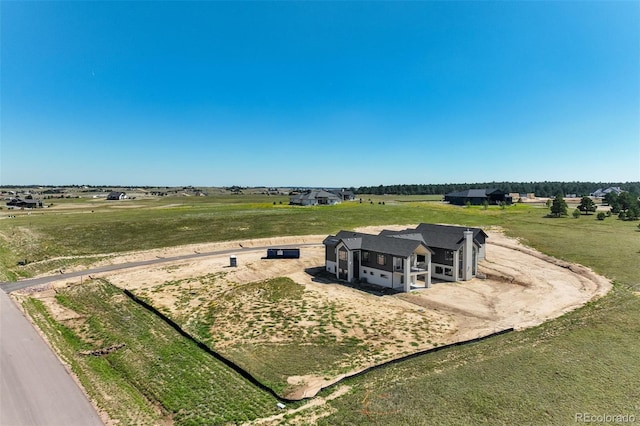 birds eye view of property featuring a rural view
