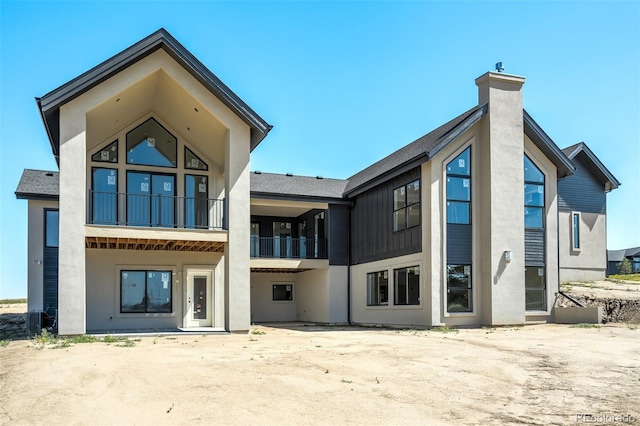 back of house with a patio