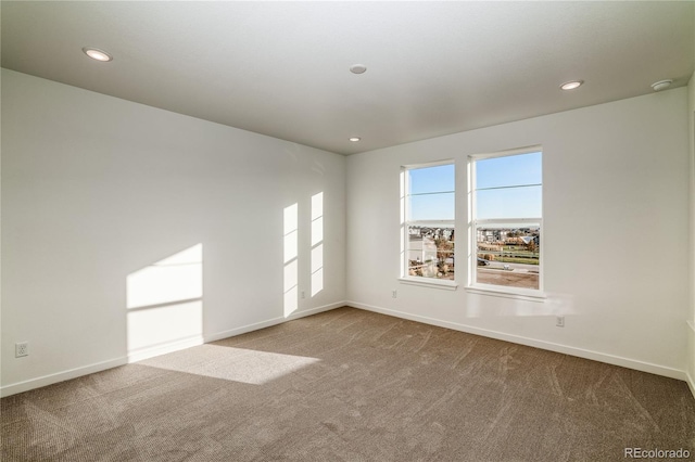 empty room featuring carpet flooring