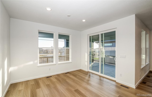 unfurnished room featuring light hardwood / wood-style flooring