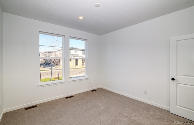 view of carpeted spare room