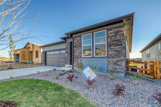 view of front of property with a garage and a front yard