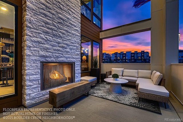 home theater room featuring an outdoor stone fireplace