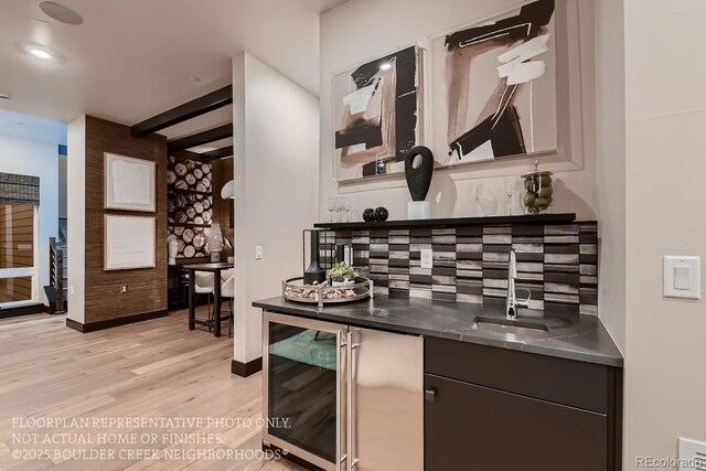 kitchen with sink, beam ceiling, light hardwood / wood-style floors, decorative backsplash, and beverage cooler