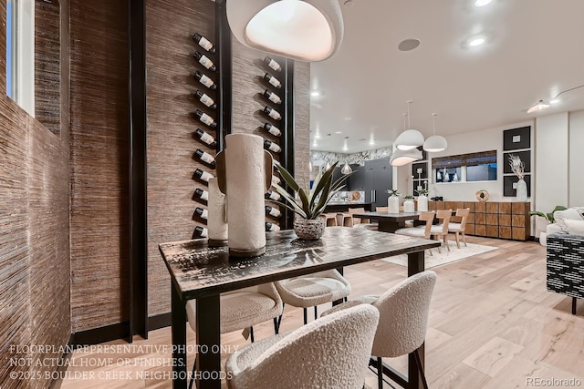 dining area with light hardwood / wood-style floors