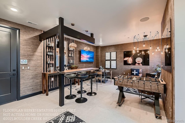 bar featuring light tile patterned floors